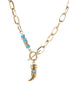 Gold chunky chain necklace with turquoise beaded accent and horn pendant on white background