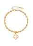 18K gold-plated oval bead chain bracelet with quatrefoil clover charm featuring mother of pearl inlay on cream background