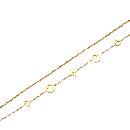 Double-layer gold-plated bracelet with quatrefoil and star charms on cream background, 18K gold finish.