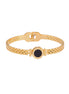 Gold mesh bracelet with circular black mother of pearl medallion featuring Roman numeral engravings and hinged clasp