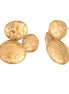 Three hammered gold discs clustered together forming organic statement earrings with textured surfaces