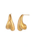 Organic sculptural gold stud earrings with fluid matte finish on cream background