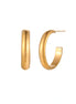 Chunky tubular hoop earrings in warm 14K gold-plated finish with smooth polished surface on cream background.